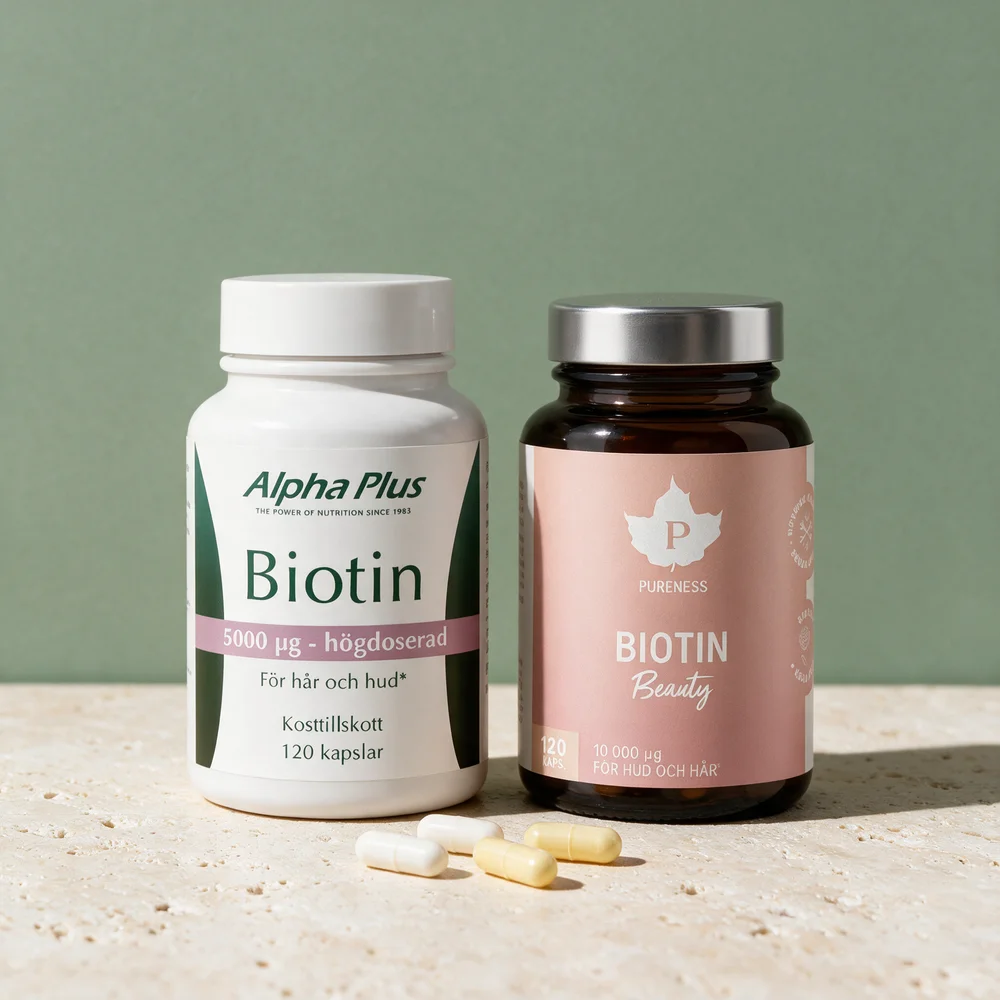 Alpha Plus Biotin i hvit boks og Pureness Biotin Beauty i brunt glass, med kapsler foran