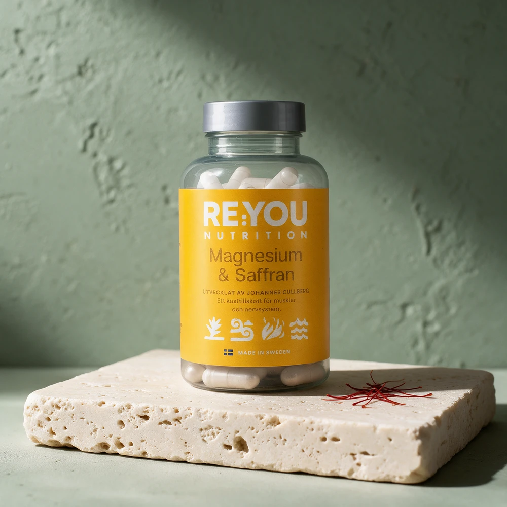 RE:YOU Magnesium + Saffran i klar krukke der de hvite kapslene synes