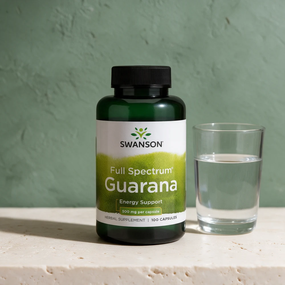 Swanson Full Spectrum Guarana, boks med 100 kapsler à 500 mg, ved et glass vann