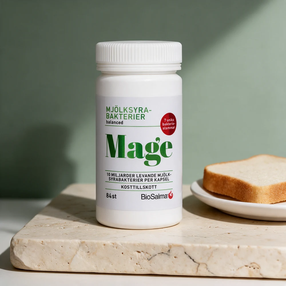 BioSalma Mjölksyrabakterier Mage, boks med 84 kapsler merket 10 miljarder per kapsel, ved en brødskive