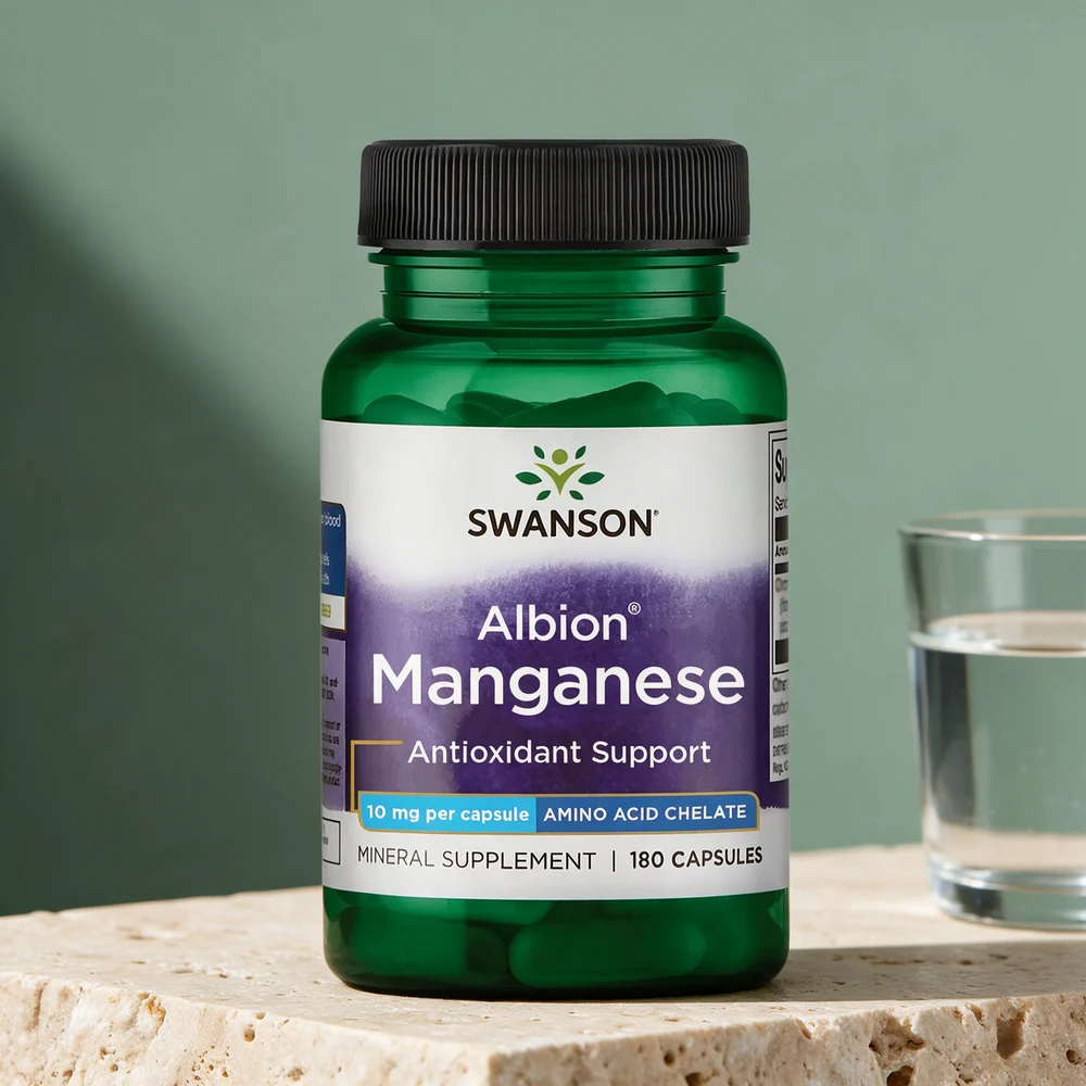 Swanson Albion Manganese 10 mg i grønn gjennomsiktig plastflaske med svart lokk, 180 kapsler, med et glass vann