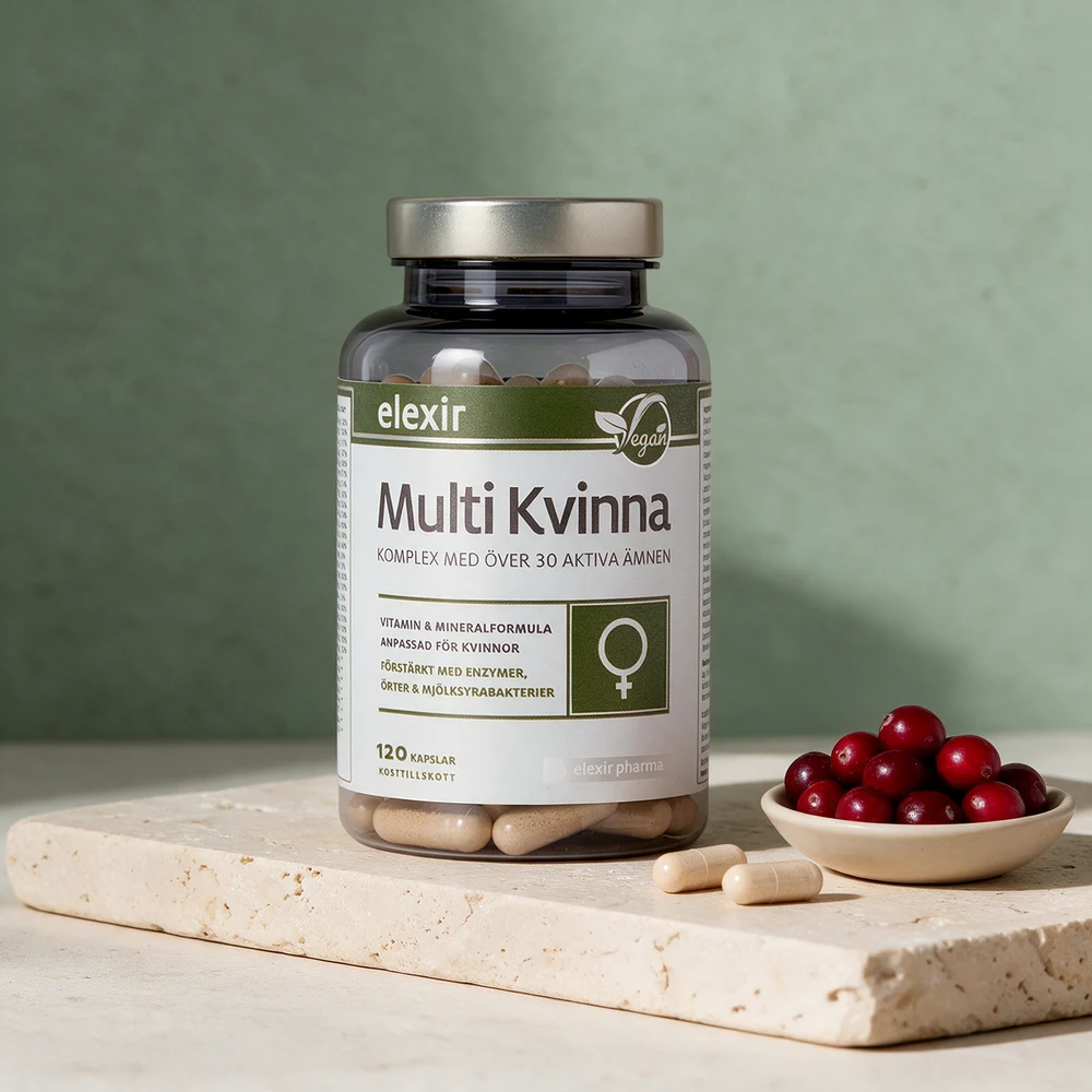 Elexir Multivitamin Kvinne, vegansk boks med 120 kapsler, to av de 23 millimeter lange kapslene og en skål tranebær