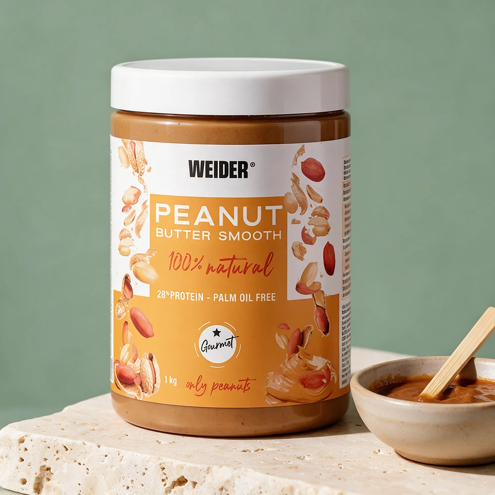 Weider Peanut Butter Smooth i 1 kg spann merket «100% natural» og «28% protein – palm oil free»