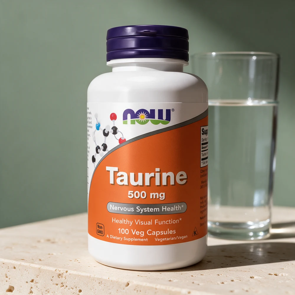 NOW Taurin, hvit flaske med oransje etikett merket «500 mg · 100 Veg Capsules»